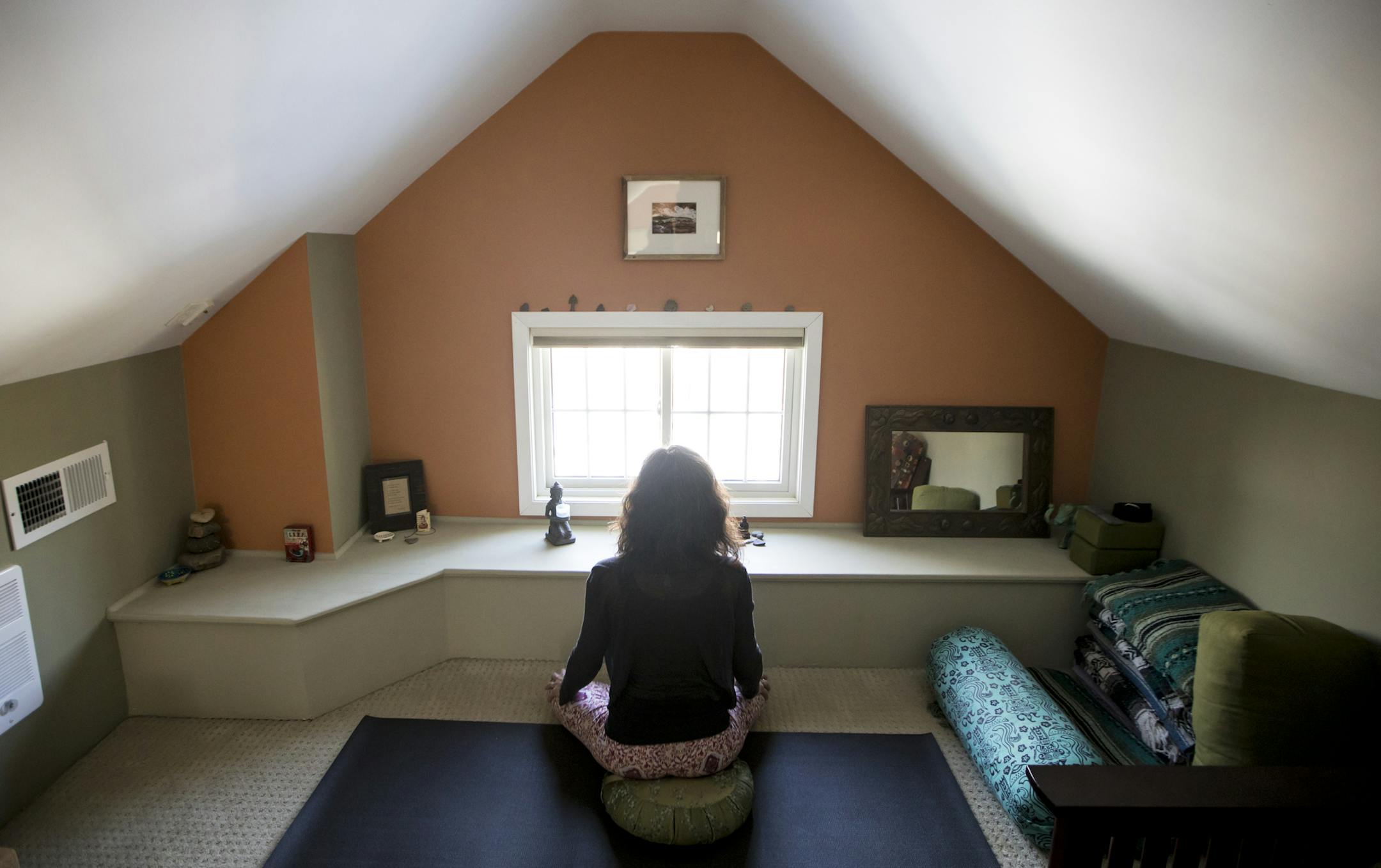 Jennifer Toddie in the bedroom she converted into a private yoga studio in her St. Paul home.