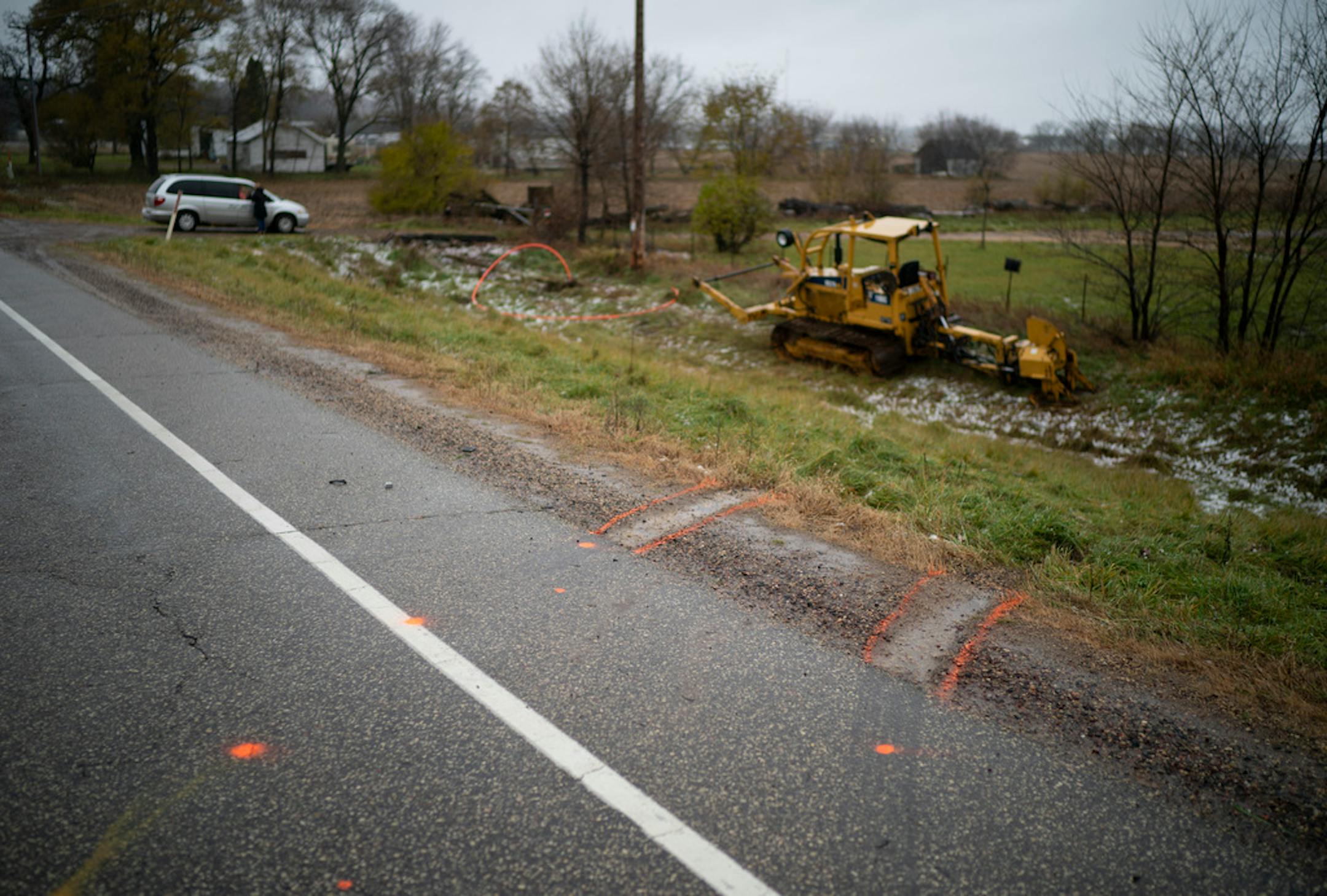 Tire tracks marked with spray paint lead to where a vehicle struck three Girl Scouts and an an adult chaperone on Sunday, Nov. 4, 2018 in Lake Hallie, Wis.