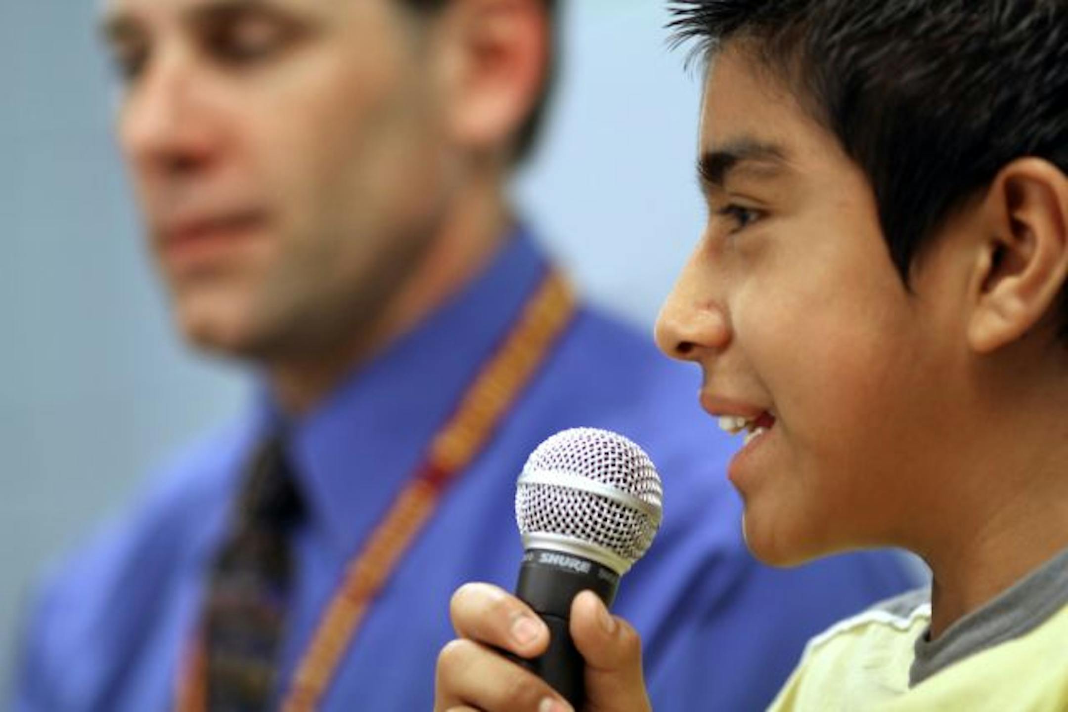 Northfield Middle School student Jose Alfredo Bravo-Barojas with Principal Jeff Pesta using SpeechGear's translator. The software helps students for whom English is a second language.