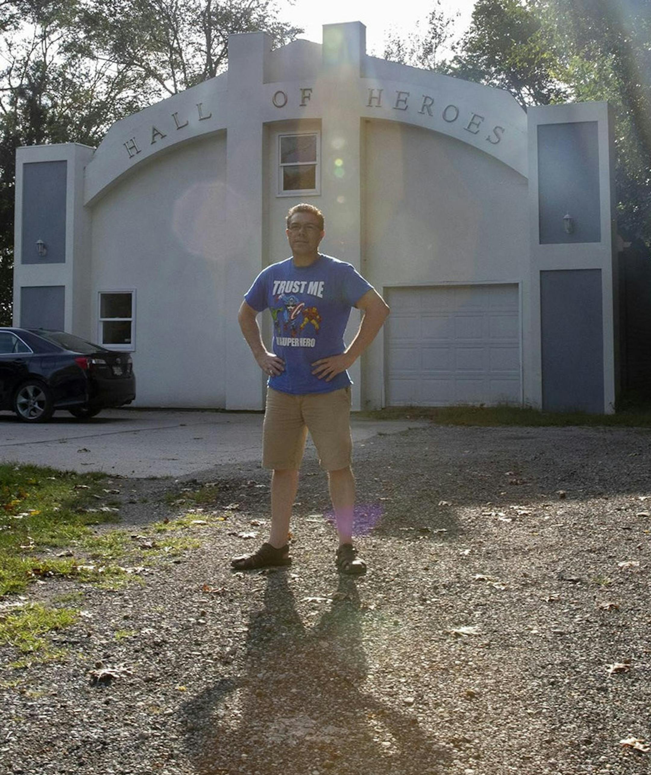 Allen Stewart poses outside the former Hall of Heroes museum sitting in his backyard in Elkhart, Ind., Sept. 13, 2019. (Camille Fine/Chicago Tribune/TNS) ORG XMIT: 1443555