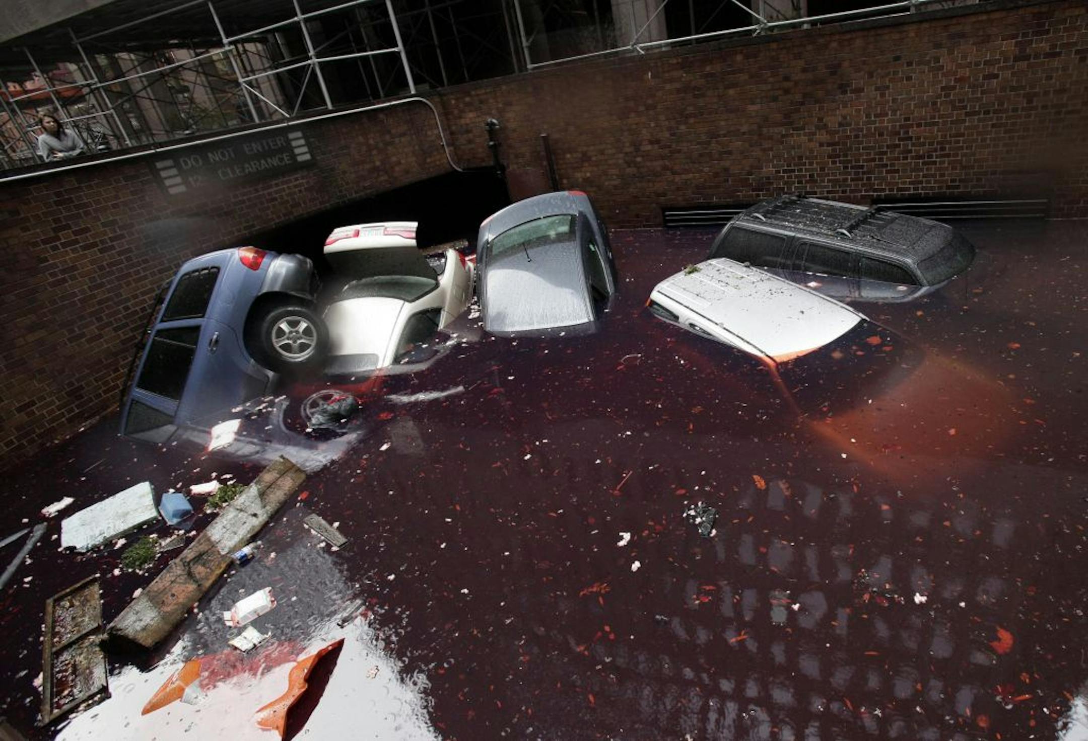 Besides used cars, many dealers said new-car inventories were ruined by the superstorm. These cars were at a New York City parking garage.