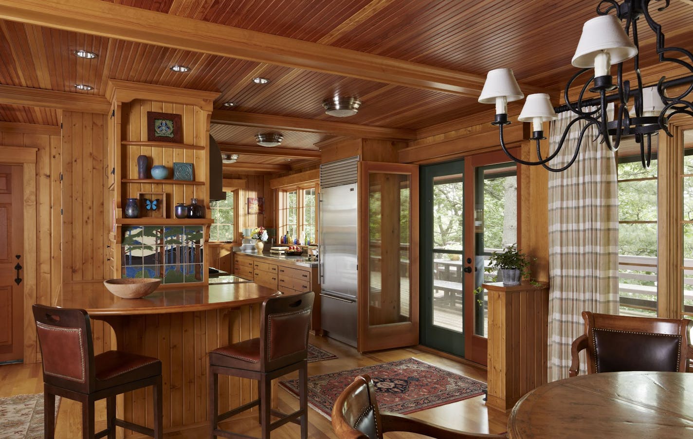 A new curved breakfast bar and cabinets match the existing pine kitchen.