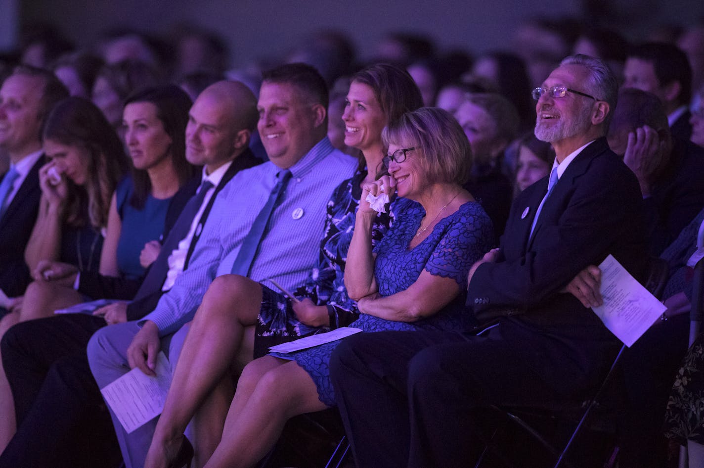 The Wetterling family including from the right, Jerry, Patty, Amy, and at far left Trevor (shaved head) and Carmen (dotting eyes with tissue) laughed as funny memories told by Jacob's cousin Allen Overturf at a memorial service for Jacob Wetterling at Clemens Field House at the College of Saint Benedict in St. Joseph, Minn., on Sunday, September 25, 2016. ] RENEE JONES SCHNEIDER &#x2022; renee.jones@startribune.com