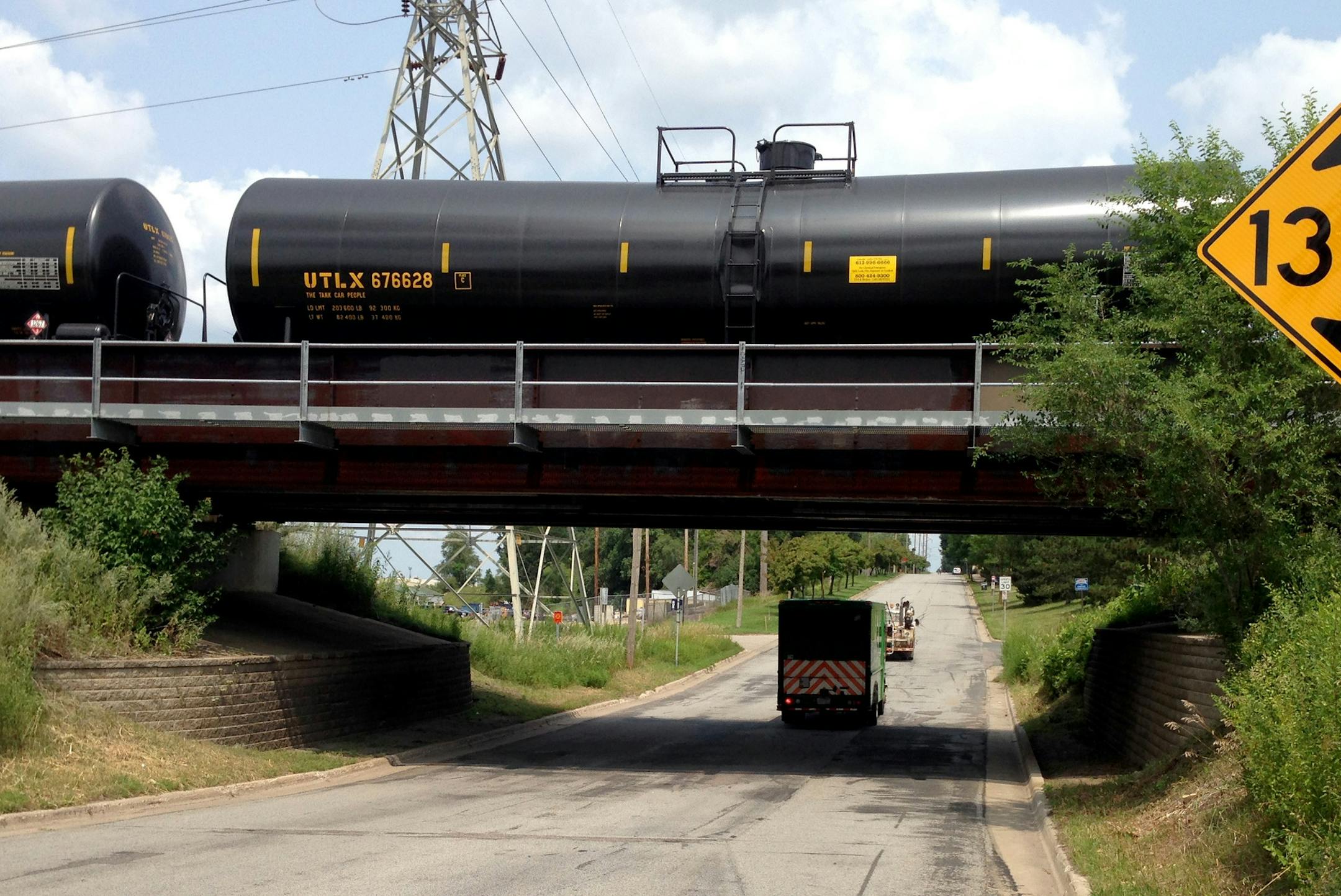 Tank cars from a Canadian Pacific oil train are stopped on a railroad overpass above Main St. NE in Minneapolis on July 30, 2014. The railroad, whose U.S. headquarters is in Minneapolis, says it expects to ship 140,000 tank car loads of crude oil this year, and an increasing number of them come from Canada's oil fields. About 54 percent of the railroad's second-quarter shipments were U.S. crude, the company says Long unit trains like this one typically come from North Dakota, but the origin of t