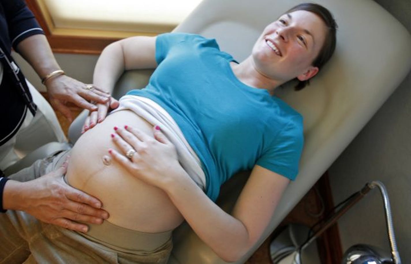 Jaclyn Bammert, who is 31 weeks pregnant, felt her baby with guidance from midwife Paula Bernini Feigal, who opened Morning Star Birth Center in April.