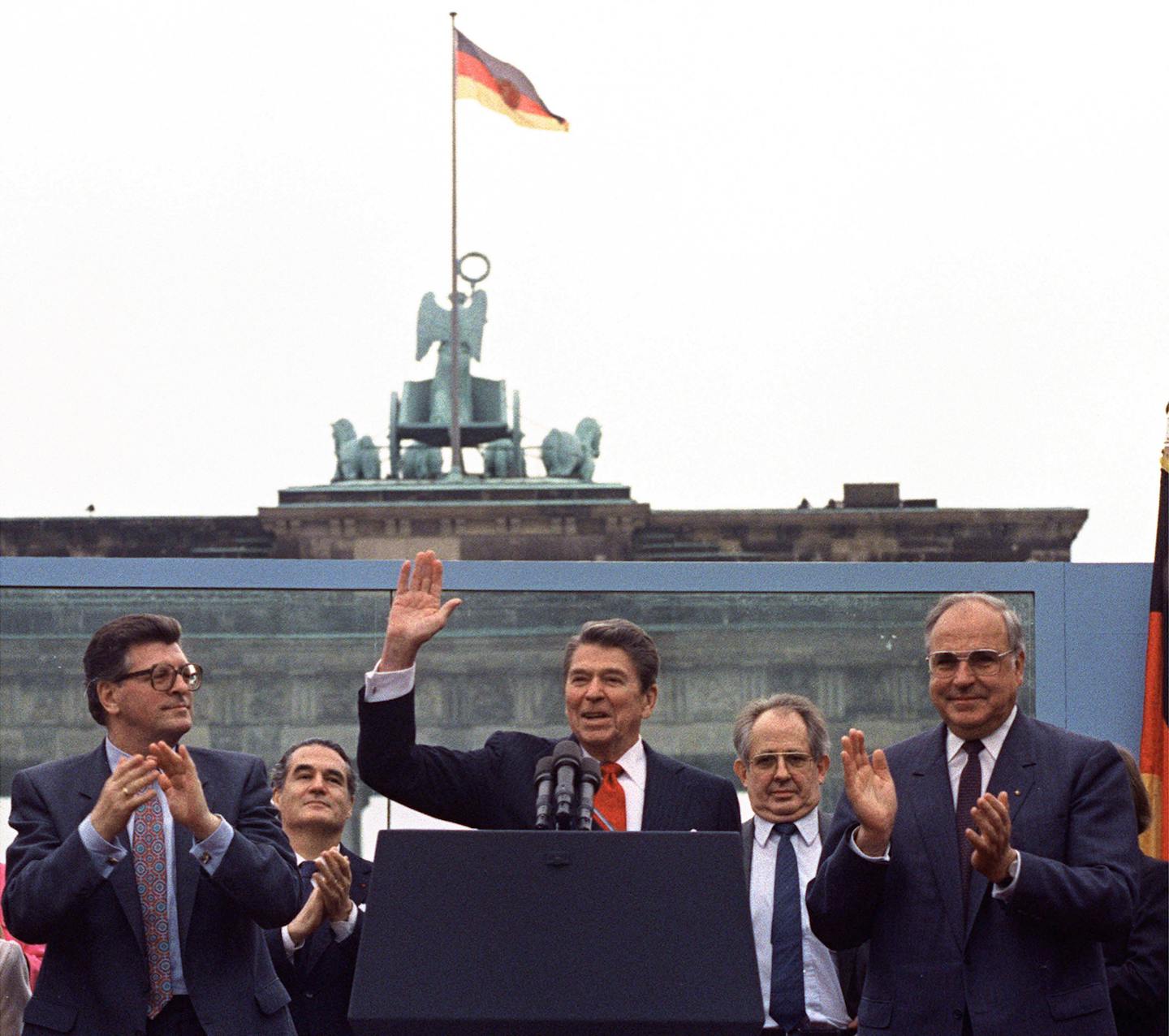 In this June 12, 1987 file photo U.S. President Reagan acknowledges the crowd after his speech in front of the Brandenburg Gate in West Berlin,  where