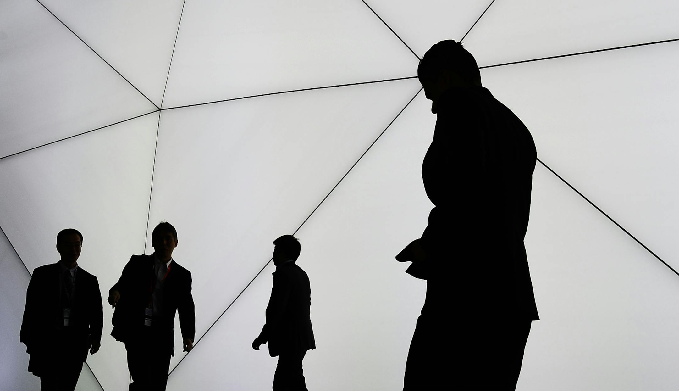 Visitors attend the the Mobile World Congress, the world's largest mobile phone trade show in Barcelona, Spain, Monday, Feb. 24, 2014. Expected highlights include major product launches from Samsung and other phone makers, along with a keynote address by Facebook founder and chief executive Mark Zuckerberg. (AP Photo/Manu Fernandez)