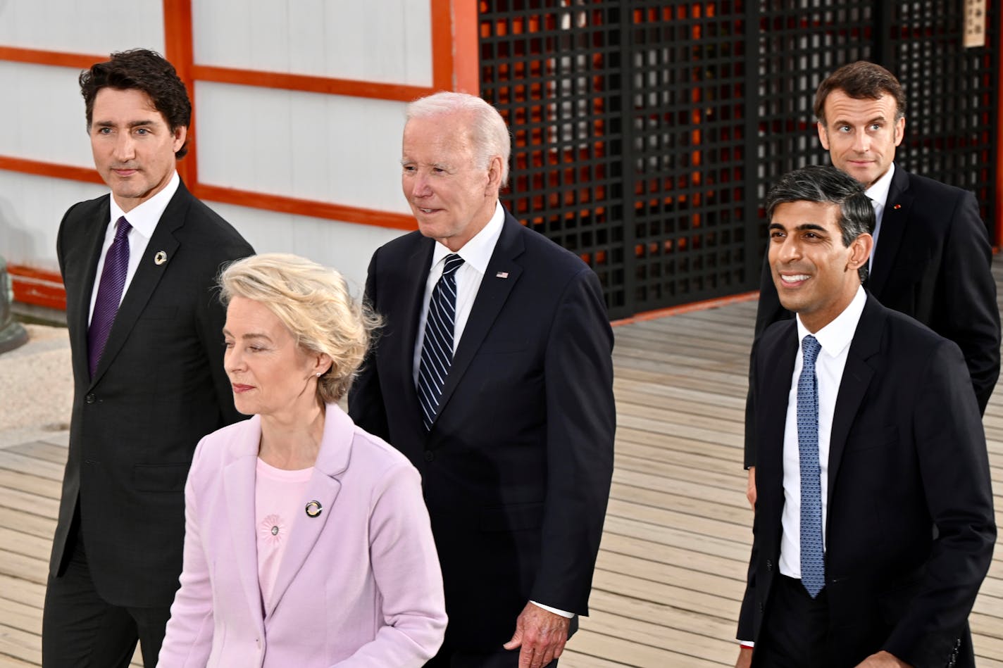 G7 leaders, from left to right, Canadian Prime Minister Justin Trudeau, European Commission President Ursula von der Leyen, U.S. President Joe Biden, Britain's Prime Minister Rishi Sunak and French President Emmanuel Macron, visit the Itsukushima Shrine on Miyajima Island in Hatsukaichi, western Japan, Friday, May 19, 2023. (Kenny Holston/Pool Photo via AP)