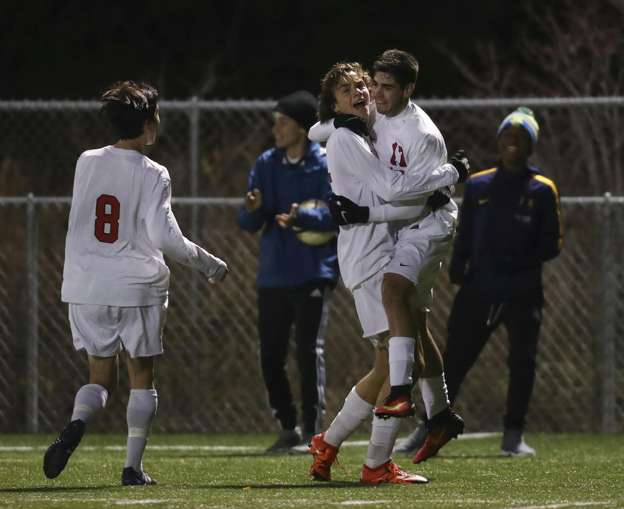 Stillwater's Miguel Caravias (17) celebrated his second half goal with Spencer Scott, who had the assist. At left was their teammate Kohei Adams. ] JEFF WHEELER &#x2022; jeff.wheeler@startribune.com Stillwater remained unbeaten with a win over Mounds View in their Class 2A Boys' State Soccer Tournament Quarterfinal game Wednesday night, October 26, 2016 at Benilde-St. Margaret's High School in St. Louis Park.