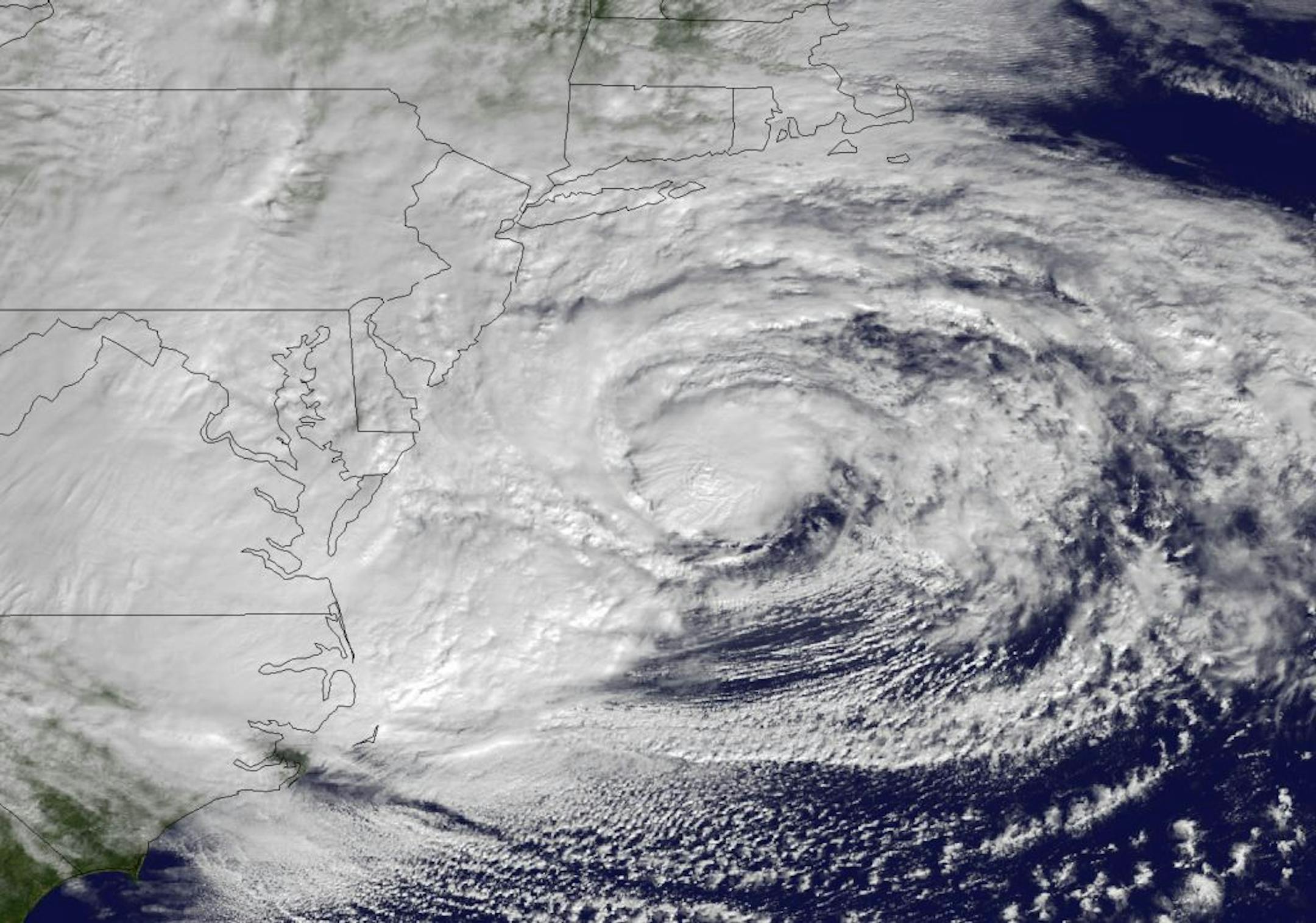 This NOAA satellite image taken Monday, Oct. 29, 2012 shows Hurricane Sandy off the Mid Atlantic coastline moving toward the north with maximum sustained winds of 90 mph. Hurricane Sandy wheeled toward land as forecasters feared Monday, raking cities along the Northeast corridor with rain and wind gusts, flooding shore towns, washing away a section of the Atlantic City Boardwalk, and threatening to cripple Wall Street and New York's subway system with a huge surge of corrosive seawater.