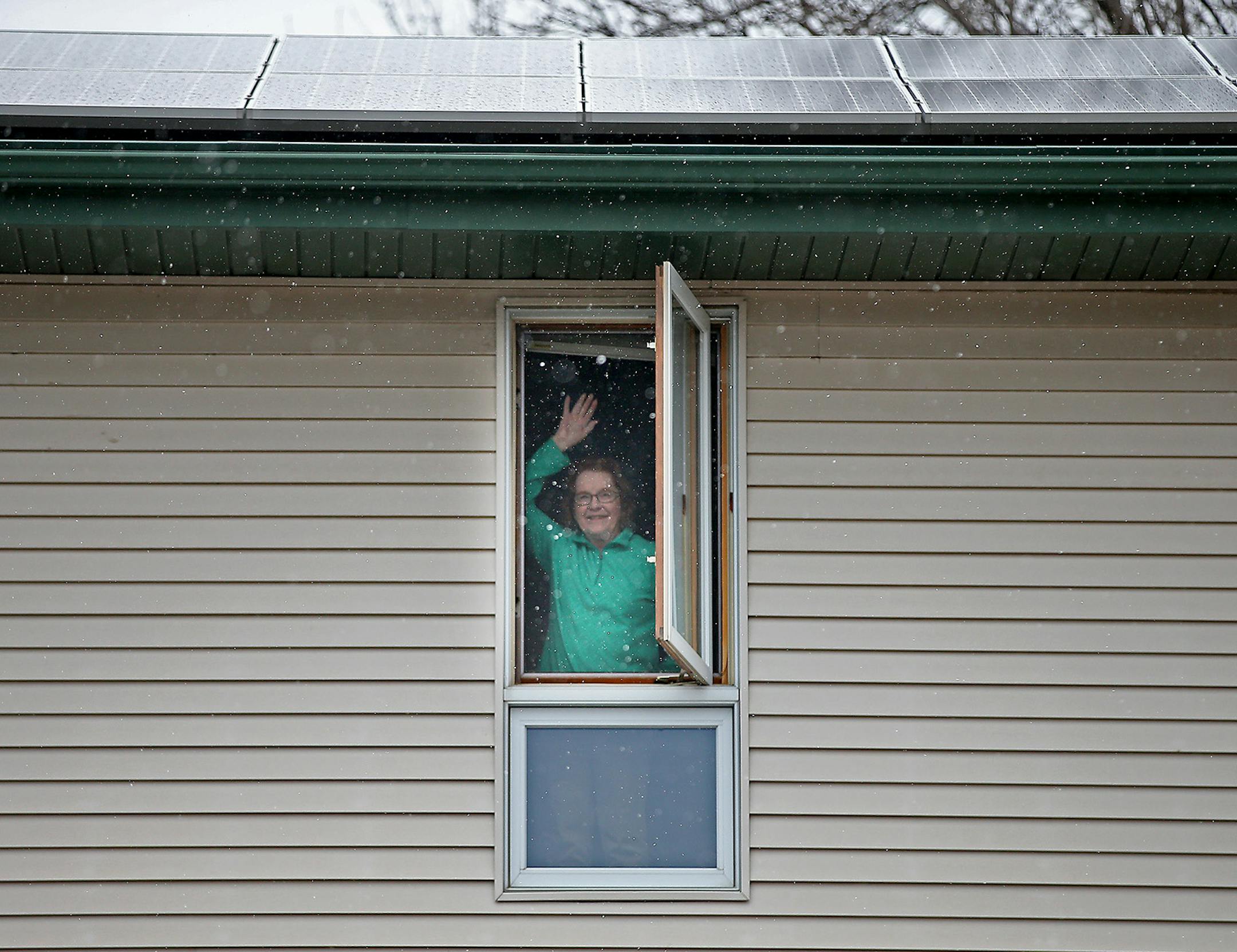 Alice Ellison waved goodbye from her home, Tuesday, April 21, 2015 in Plymouth, MN. For her 90th birthday Ellison's gift to the planet at the start of her tenth decade is the array of solar panels installed last week on the roof of her Plymouth home. Before the solar panels, Ellison depended mostly on light coming from her windows and doors. ] (ELIZABETH FLORES/STAR TRIBUNE) ELIZABETH FLORES • eflores@startribune.com