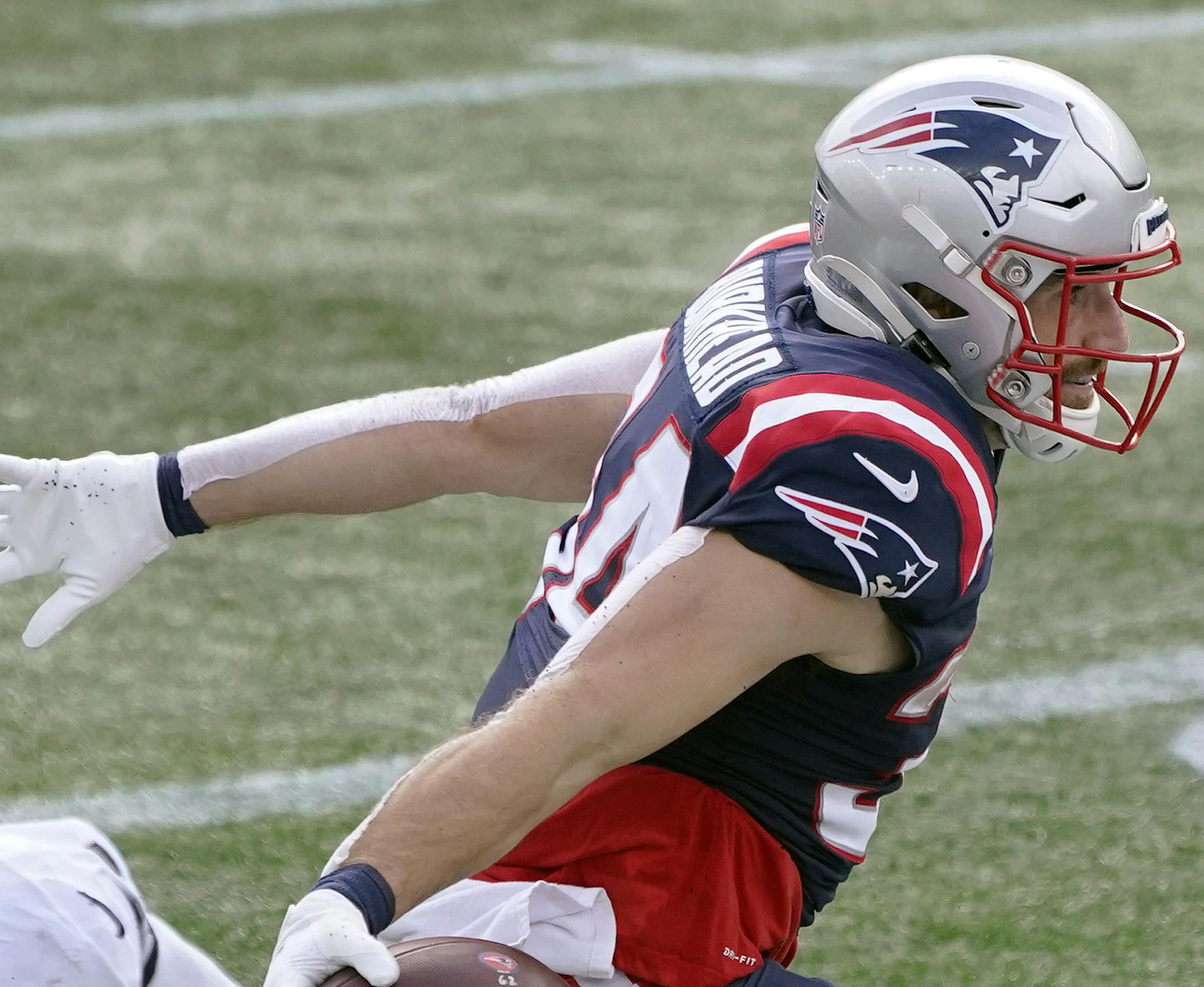 New England Patriots running back Rex Burkhead celebrates his touchdown catch from quarterback Cam Newton in the first half of an NFL football game against the Las Vegas Raiders, Sunday, Sept. 27, 2020, in Foxborough, Mass. (AP Photo/Charles Krupa)