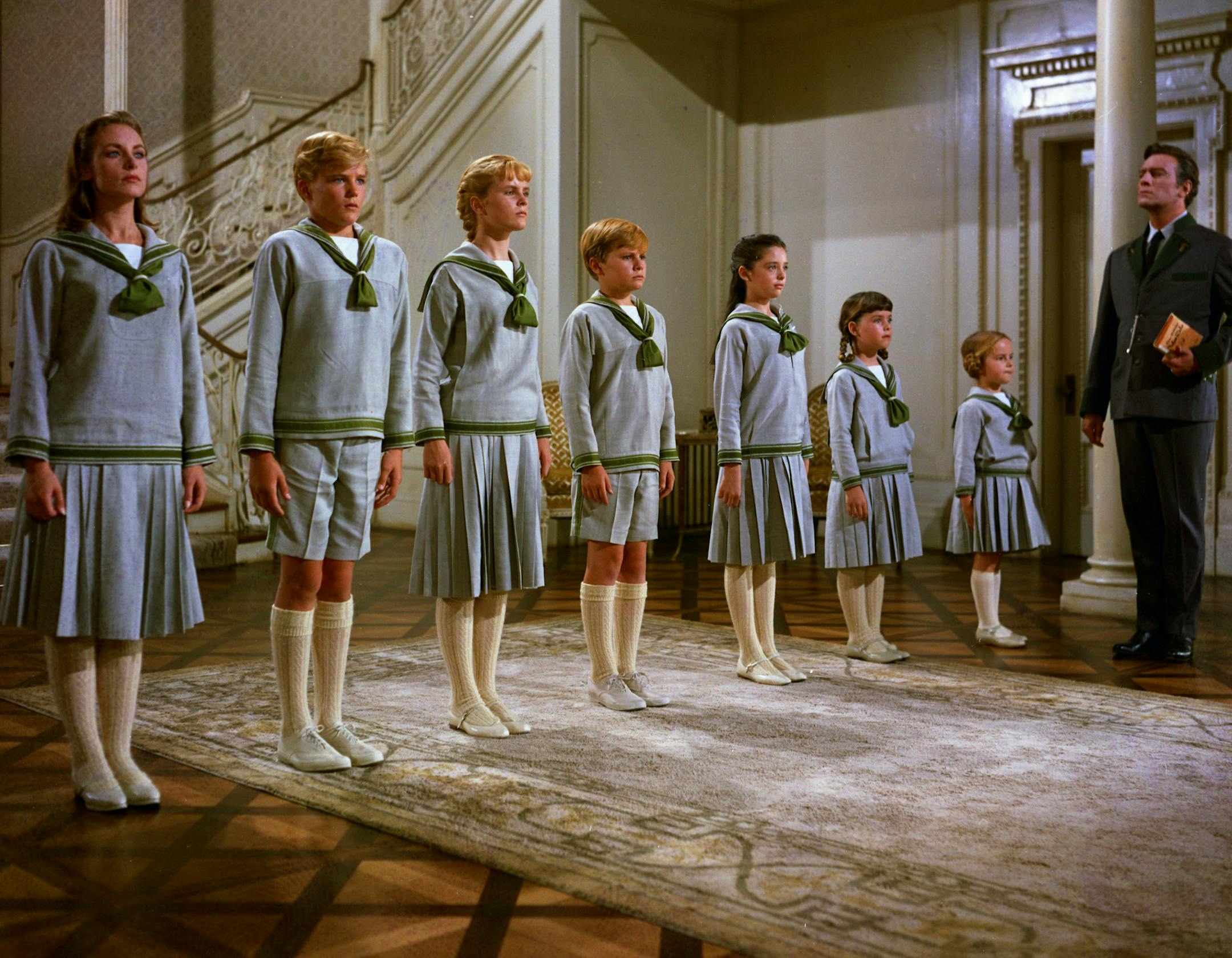 This photo provided by Twentieth Century Fox Home Entertainment shows, from left, Chairmian Carr, as Liesl, Nicholas Hammond, as Friedrich, Heather Menzies, as Louisa, Duane Chase, as Kurt, Angela Cartwright, as Brigitta, Debbie Turner, as Marta, Kym Karath, as Gretl, and Christopher Plummer, as Captain Von Trapp, in a scene from the film, "The Sound of Music." The 1965 Oscar-winning film adaptation of the Rodgers & Hammerstein musical "The Sound of Music" is celebrating its 50th birthday in 201