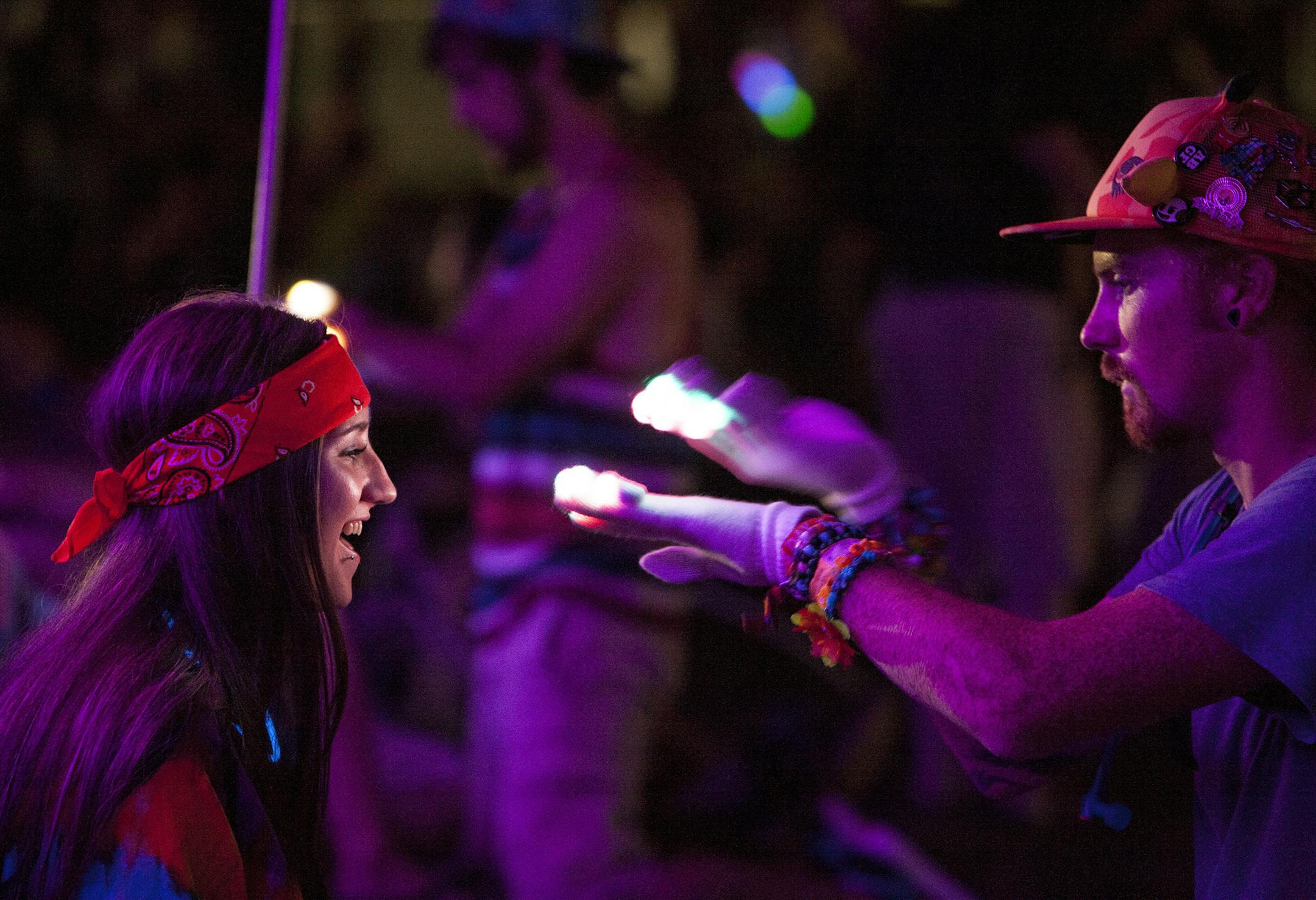 A fan at the Summer Set festival played with lighted gloves during Kaskade's headlining set Friday.