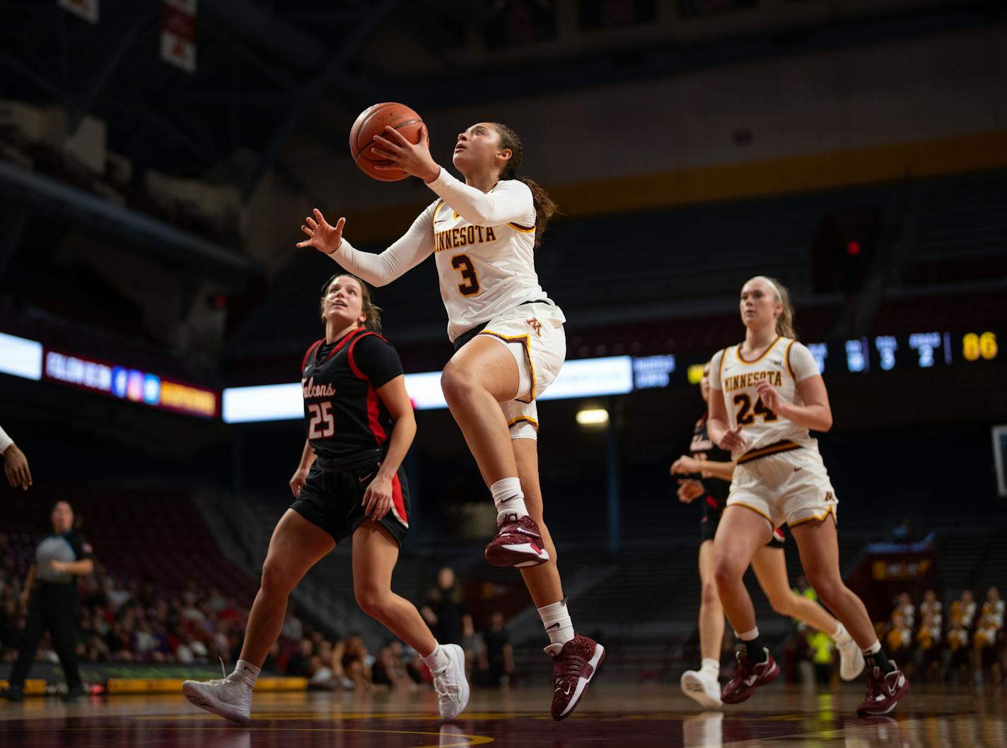 Minnesota Gophers guard Amaya Battle (3) shot after she drove past UW-River Falls guard Kassie Heinrichs (25) in the fourth quarter Sunday, Oct. 30, 2022 at Williams Arena on the U of M campus in Minneapolis. The Minnesota Gophers defeated the UW-River Falls Falcons 104-64 in a preseason women's basketball game. ] JEFF WHEELER • Jeff.Wheeler@startribune.com