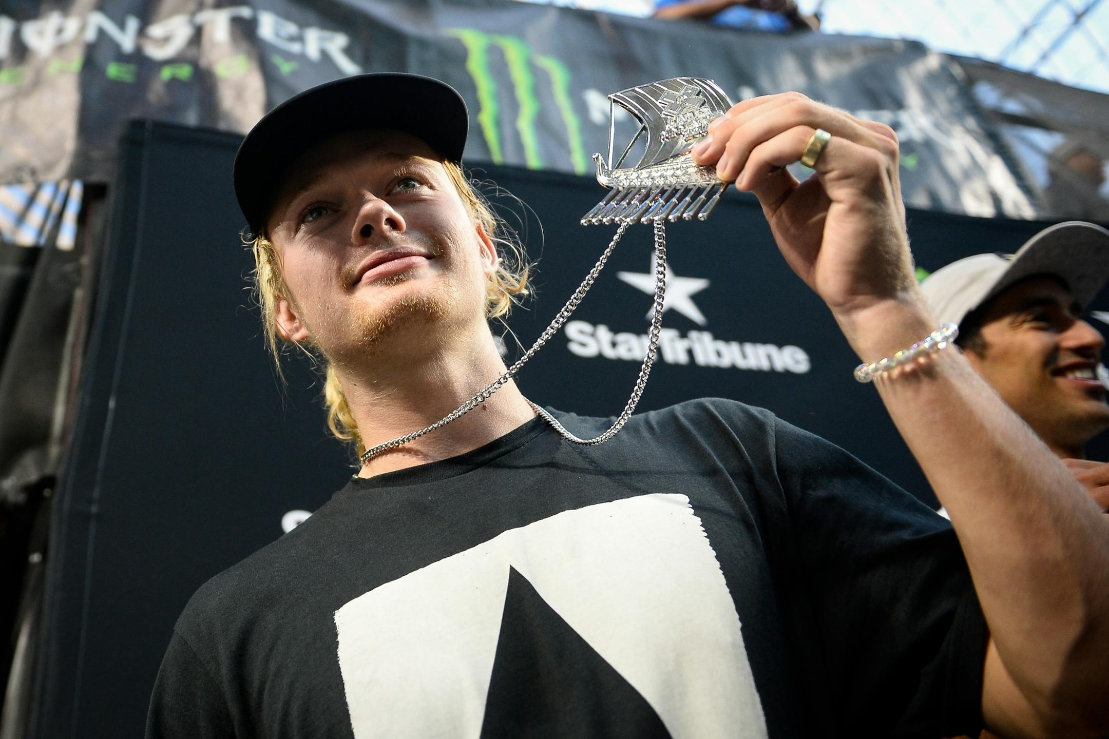 Alec Majerus held up his silver medal after competing in the skateboarding street finals Saturday night.