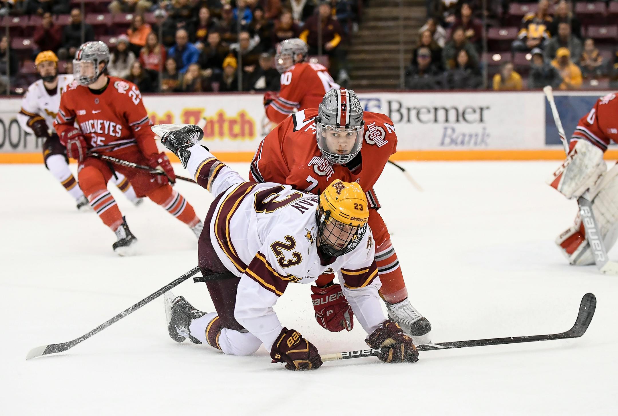 Minnesota Golden Gophers forward Ryan Norman (23) fell to the ice while being challenged by Ohio State Buckeyes defenseman Wyatt Ege (7) in the third period. ] AARON LAVINSKY ï aaron.lavinsky@startribune.com The University of Minnesota Golden Gophers mens hockey team played the Ohio State University Buckeyes Saturday, Feb. 17, 2018 at the 3M Arena at Mariucci in Minneapolis, Minn.