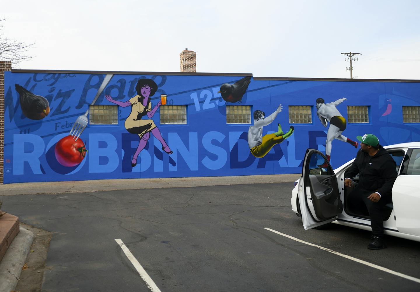 Eddie, of Maple Grove, who did not wish to have his last name identified, got out of his car outside Pawn America Friday in Robbinsdale. Behind him, a recently finished mural outside Welna Ace Hardware. ] Aaron Lavinsky &#x2022; aaron.lavinsky@startribune.com A strip of Broadway Avenue in Robbinsdale is rapidly turning into a walkable "Eat Street" of locally-owned restaurants and shops. A new brewery now sits across from a popular Costa Rican joint. Down the block is Pig Ate My Pizza and the own