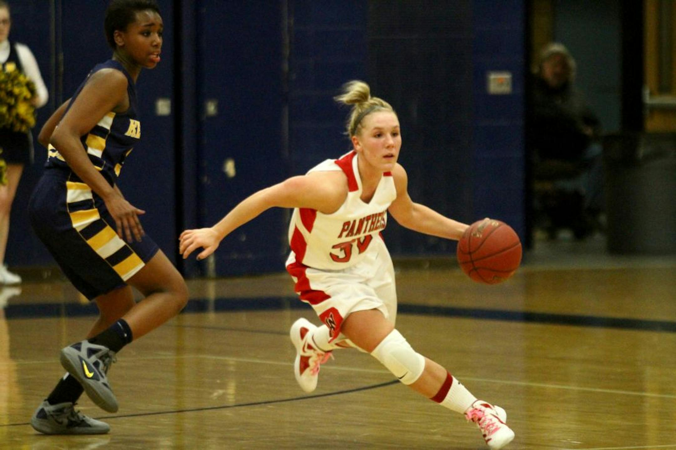 Lakeville North guard Taylor Stewart made a move around Kennedy guard Tonoia Wade during a recent game. The Panthers are in a bit of a rebuilding mode this season but remain one of the top teams in the metro area.