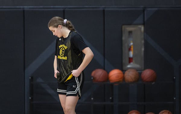 Chloe Johnson takes to the court for practice at Marshall High School in Duluth.