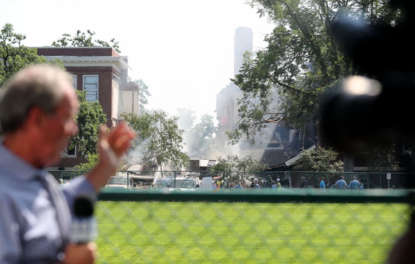 An explosion and building collapse at Minnehaha Academy. Here, TV news crews broadcast live near the explosion site Wednesday, Aug. 2, 2017, in Minneapolis, MN.