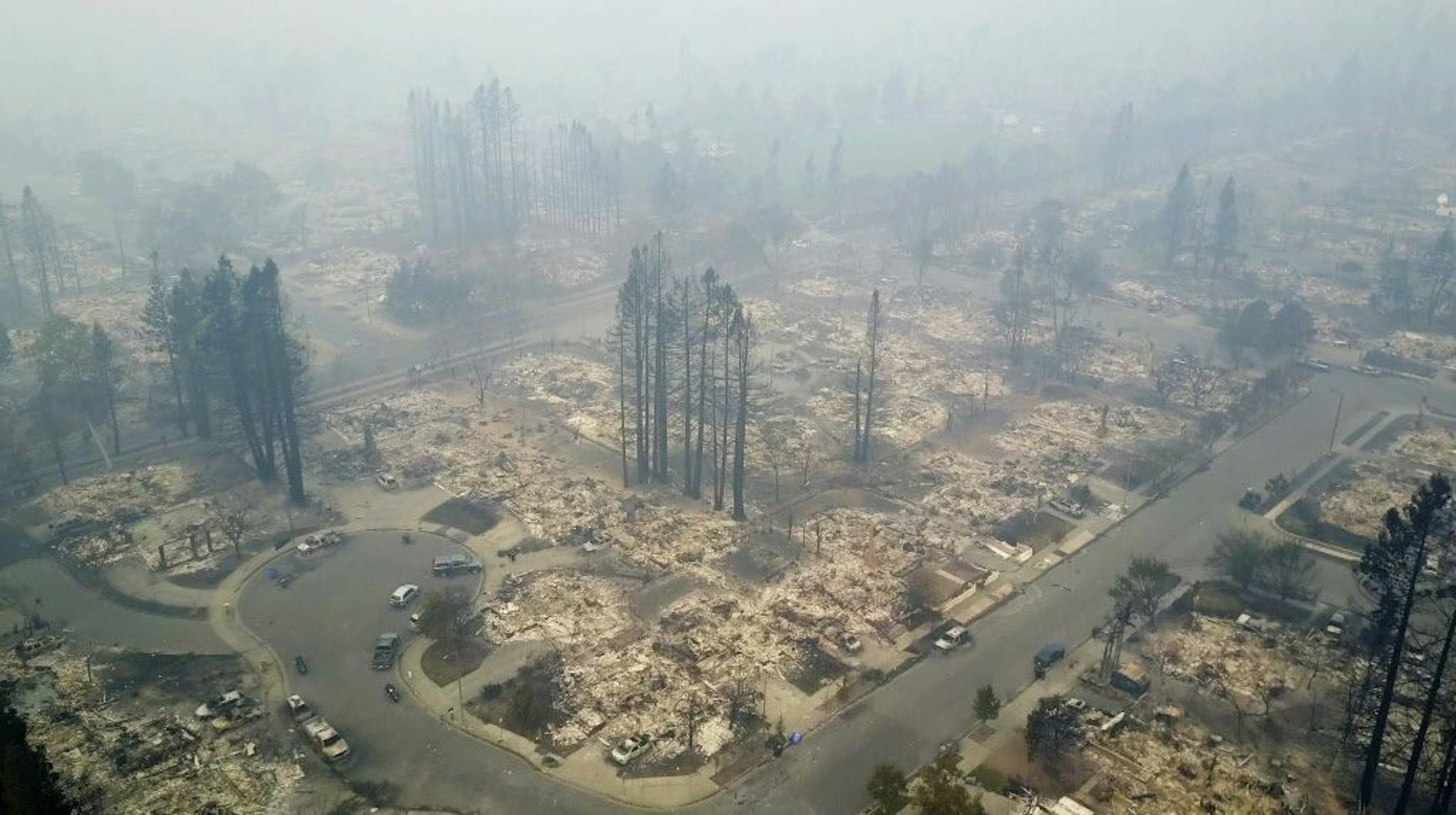 This aerial image shows a neighborhood that was destroyed by a wildfire in Santa Rosa, Calif., Tuesday, Oct. 10, 2017. Newly homeless residents of California wine country took stock of their shattered lives Tuesday, a day after deadly wildfires destroyed homes and businesses.