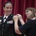 Brigadier General Stefanie Horvath left, had a star pinned on her uniform by Christy Starks her wife and her mother Catherin Horvath during a promotio