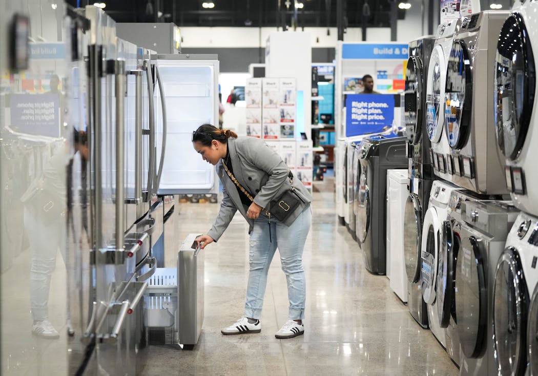 Precious Bacordio shops for kitchen appliances for her new home at a Best Buy store on Thursday, Nov. 16, in Richfield. 
