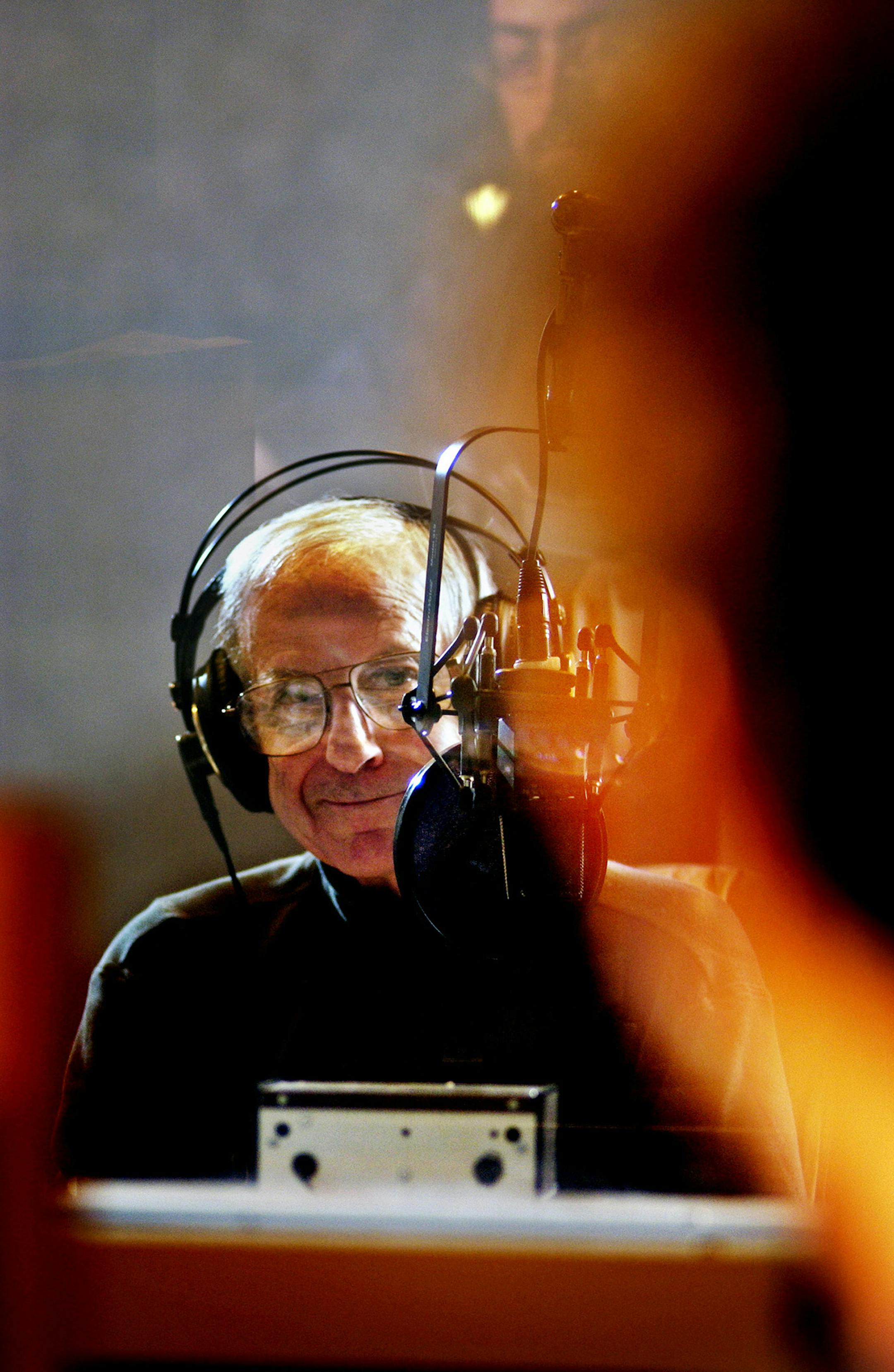 SAT_07/20/02_St.Paul - - - - - - Leigh Kamman glances at engineer Sam _____ after a sucessful live interview during the airing the Jazz Image program at MPR studio 4E.