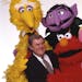 Photo of Bince Egan with some cast members of Sesame Street.