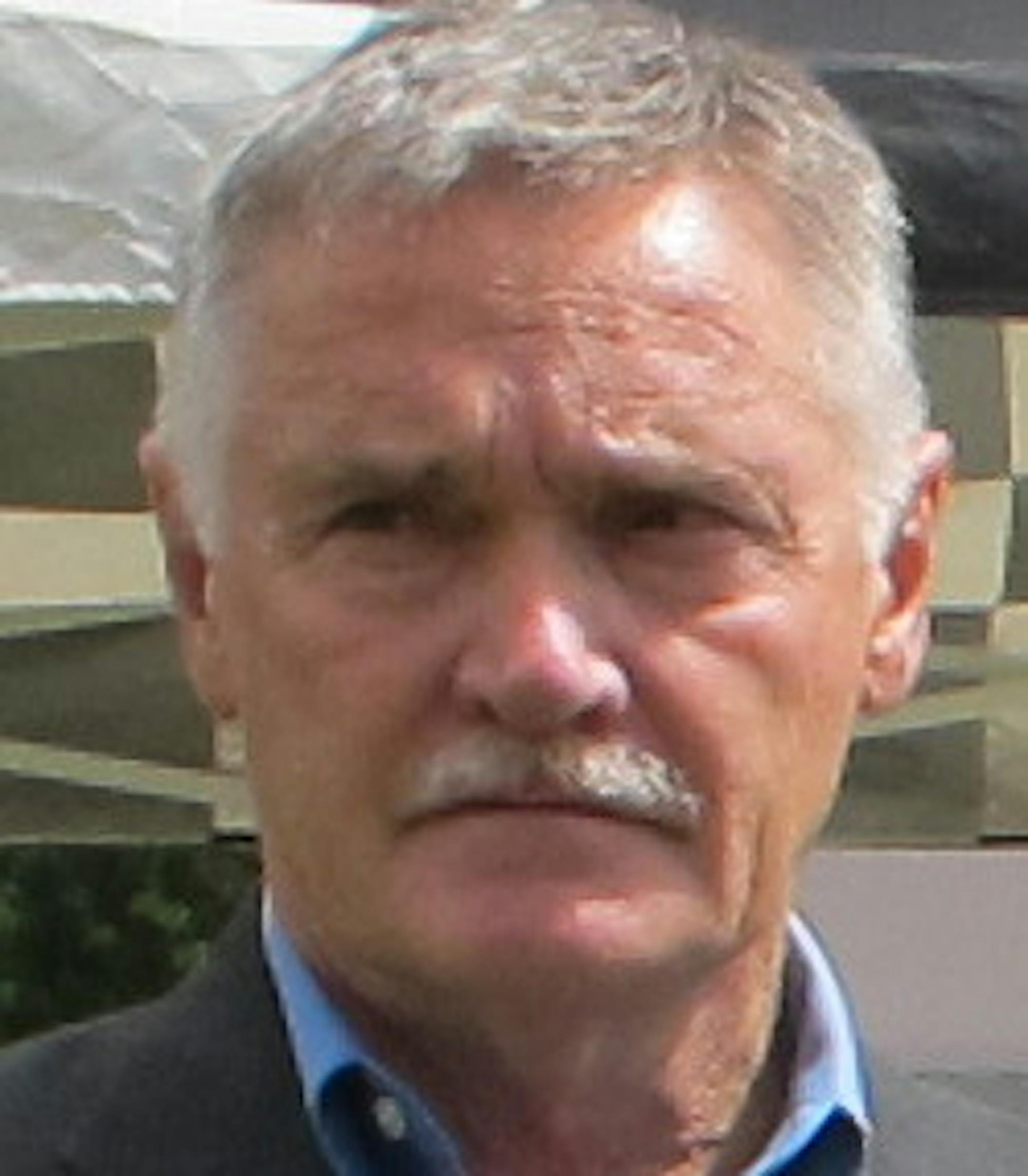 Photo by Erin Adler. Rosemount Mayor Bill Droste, homeowner Joy Peterson and Rebuilding Together Twin Cities executive director Kathy Greiner talked in the backyard of Peterson's home after most repairs were complete.