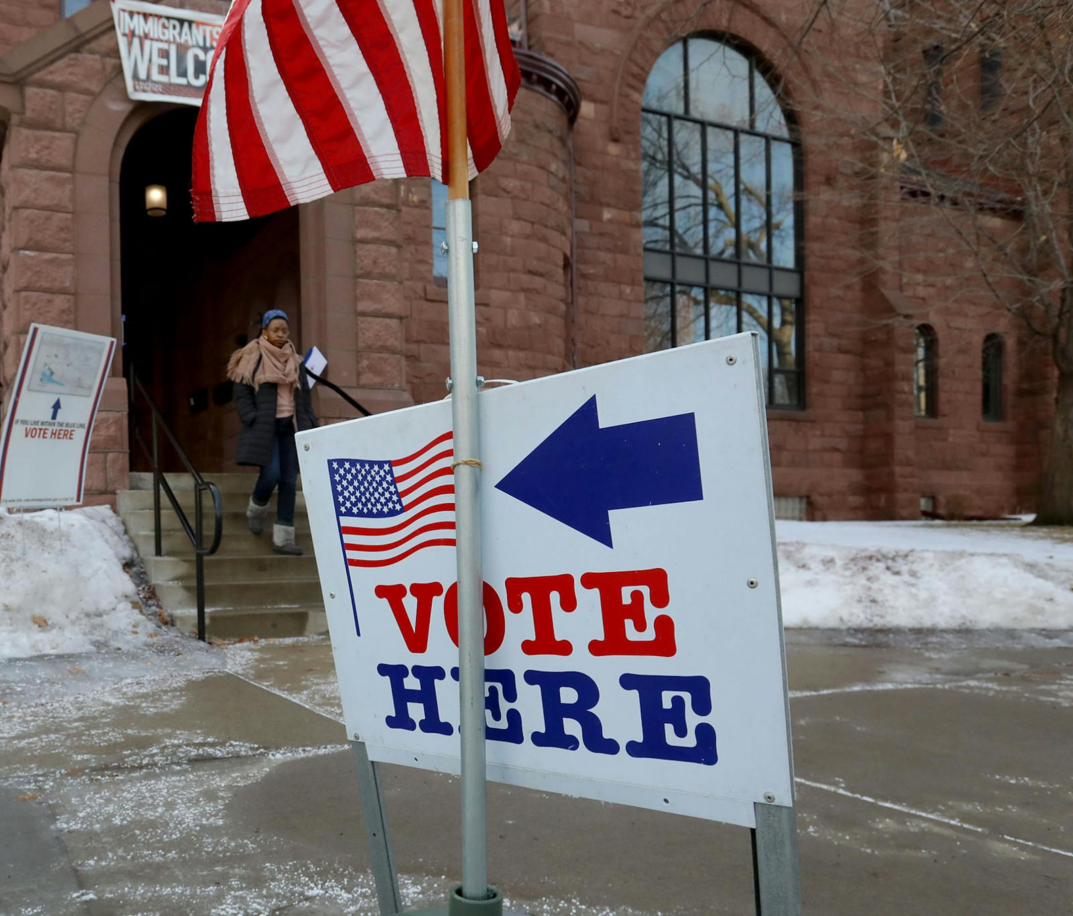 A voter leaves after casting her ballot at historic First Congregational Church in the Marcy-Holmes neighborhood of Minneapolis during Minnesota's presidential primary on Super Tuesday.