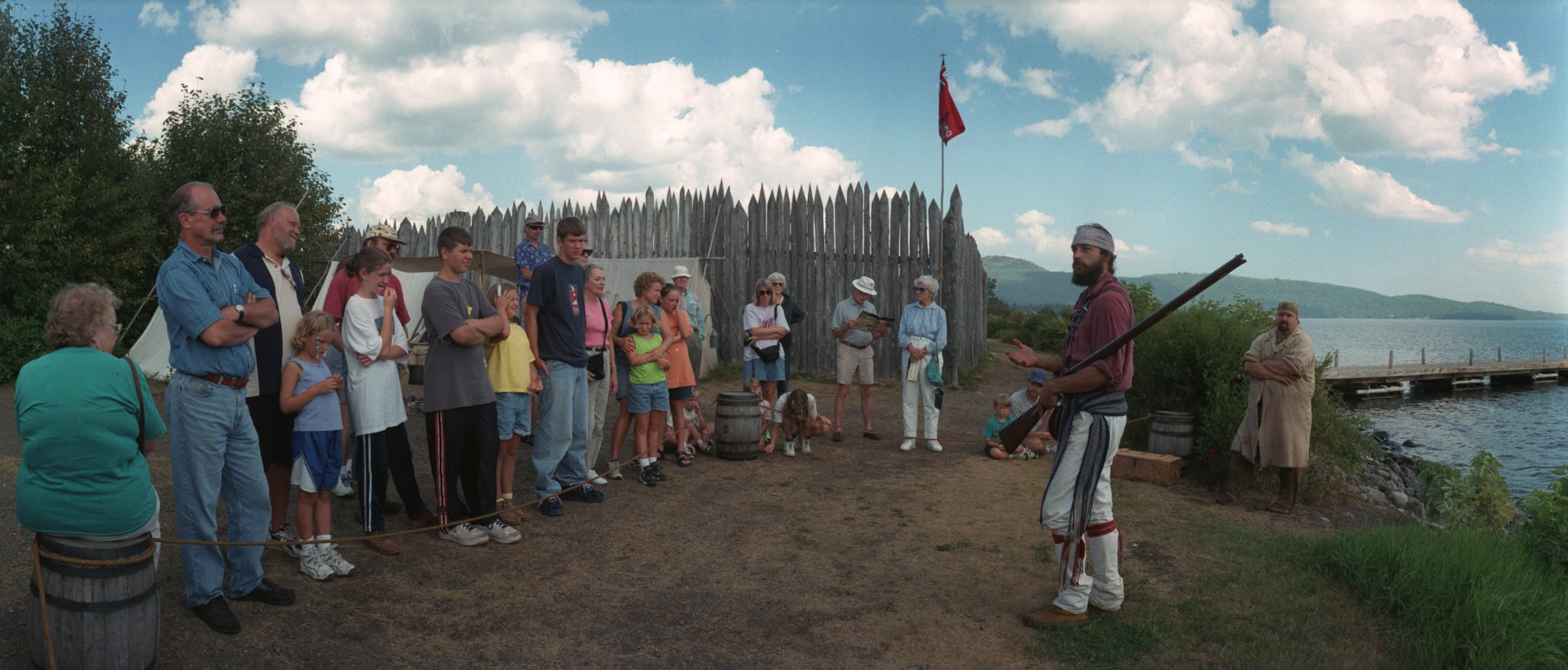 Eric Simula, a seasonal ranger employed at Grand Portage National Monument, explained the workings of a flint lock musket for visitors before loading it with black powder and firing it over Lake Superior. He was playing the role of a Northman, or Voyageur, at the Historic Depot. t.