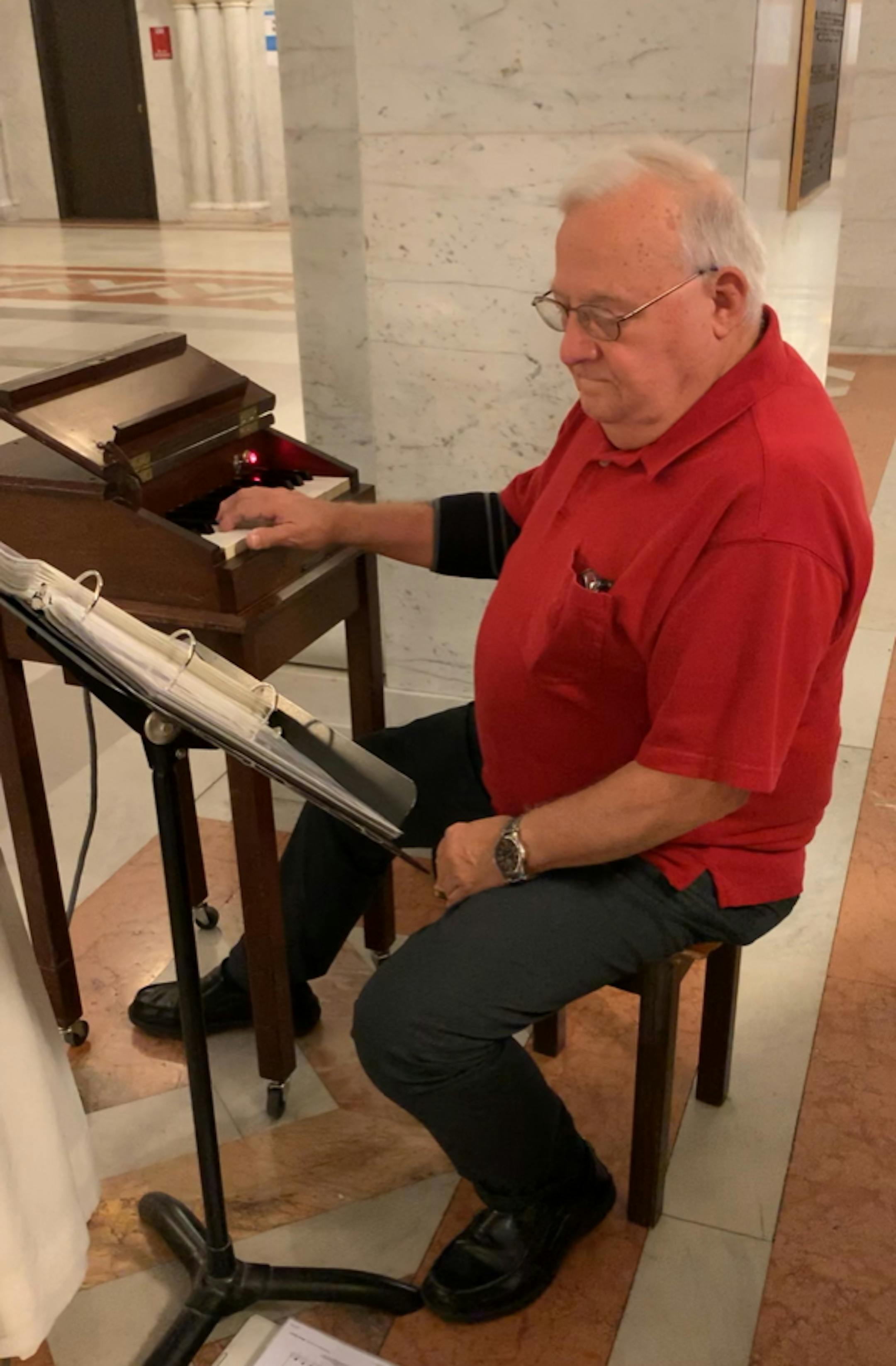Pierre Girard at work, making music at City Hall.