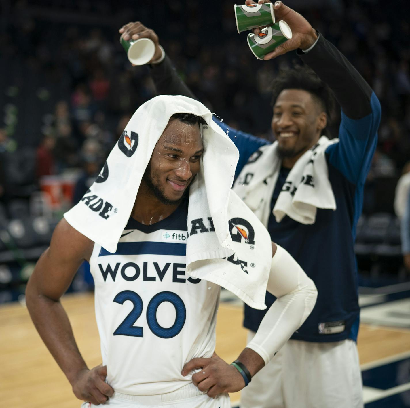 Josh Okogie turned to look back at his Timberwolves teammate Robert Covington after receiving a mini-Gatorade shower from him while he was being interviewed by Fox Sports North's Marney Gellner after the game. ] JEFF WHEELER &#xef; jeff.wheeler@startribune.com The Minnesota Timberwolves defeated the Sacramento Kings 132-105 in an NBA basketball game Monday night, December 17, 2018 at Target Center in Minneapolis.