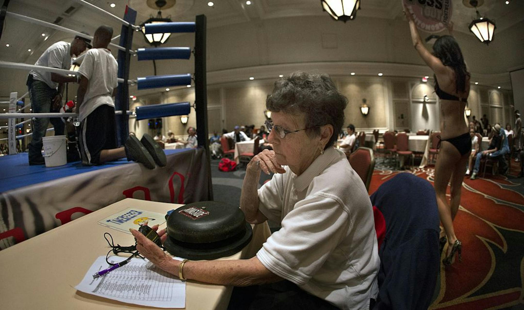 FOR DUETS COLUMN: Lilly Cronberg recently served as timekeeper during a series of amateur boxing bouts at a downtown St. Paul hotel, along with Vern Sweeney, who served as a judge.