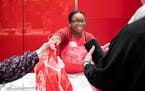 Alissa Jones brought out an order for a customer at the order pickup desk at the downtown Minneapolis Target store in February.