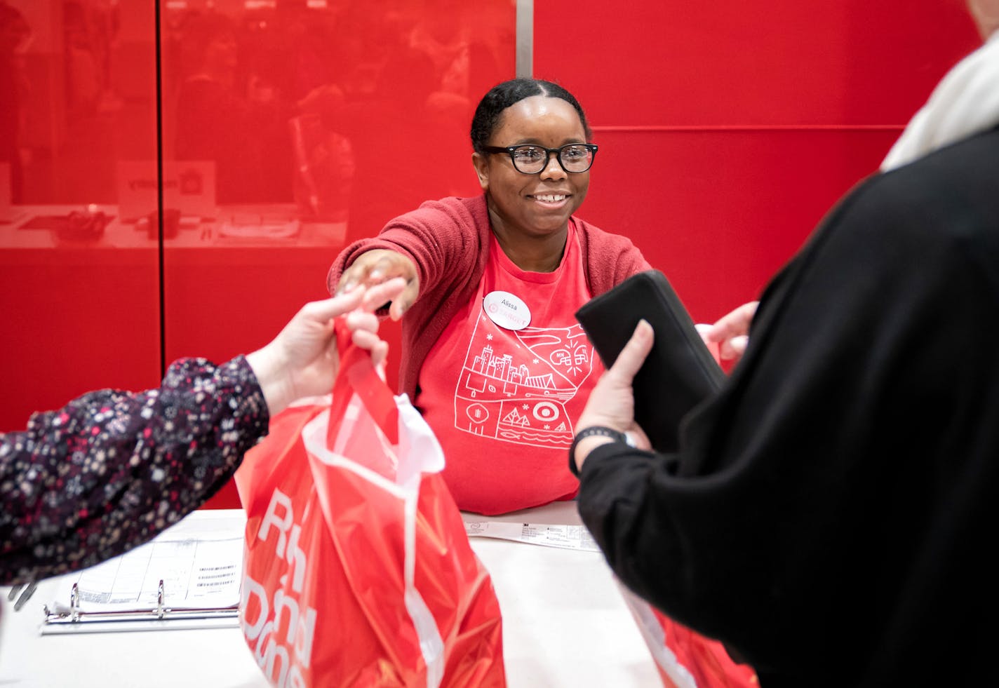 Alissa Jones brought out an order for a customer at the order pickup desk at the downtown Minneapolis Target store in February.