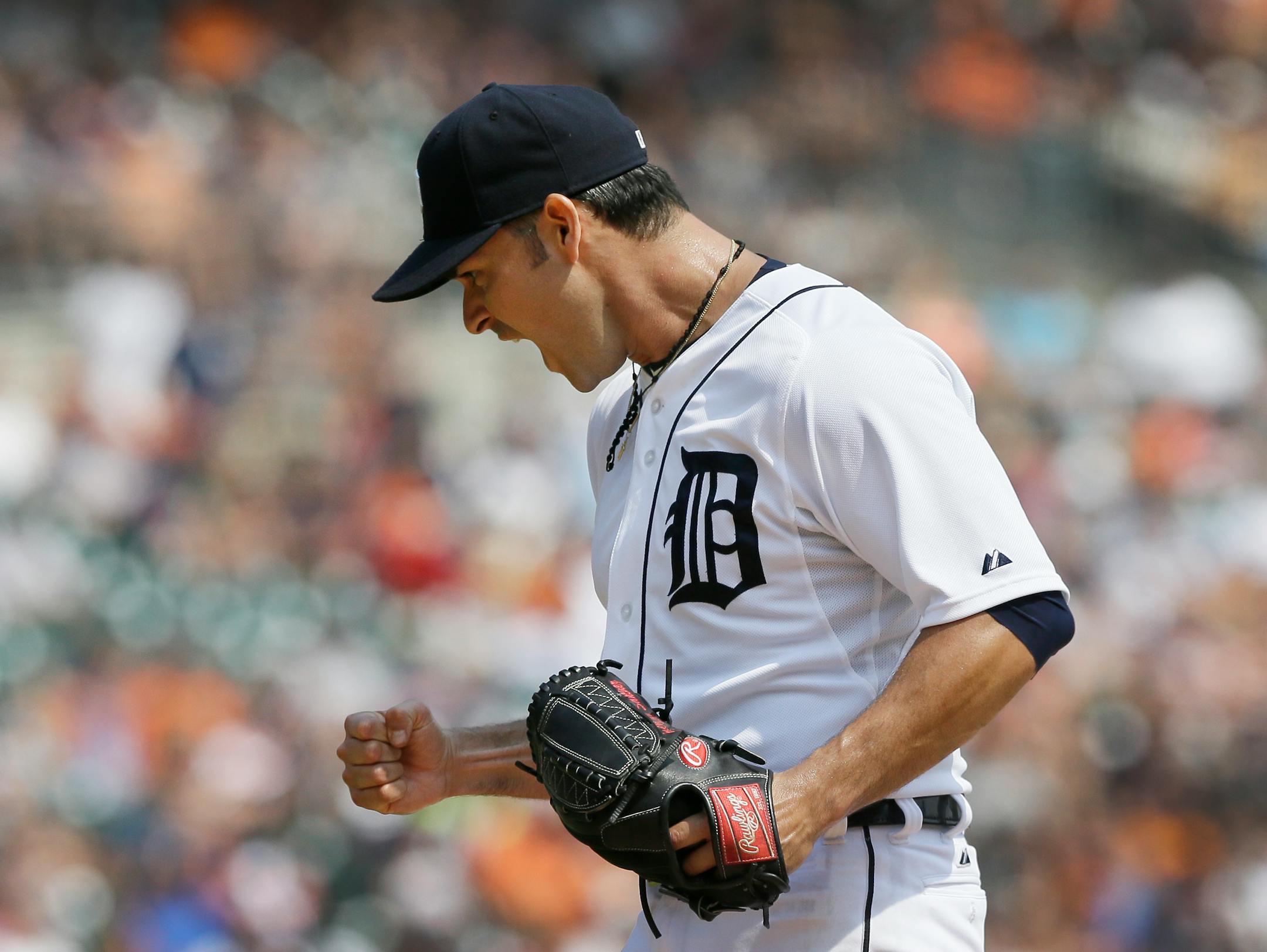 Detroit starter Anibal Sanchez reacts during the eighth inning against Colorado on Sunday. Sanchez struck out 12 in the Tigers' 4-0 victory.