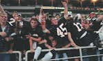 Eden Prairie players jumped into the stands at the conclusion of a close state championship game against Blaine in 1996.