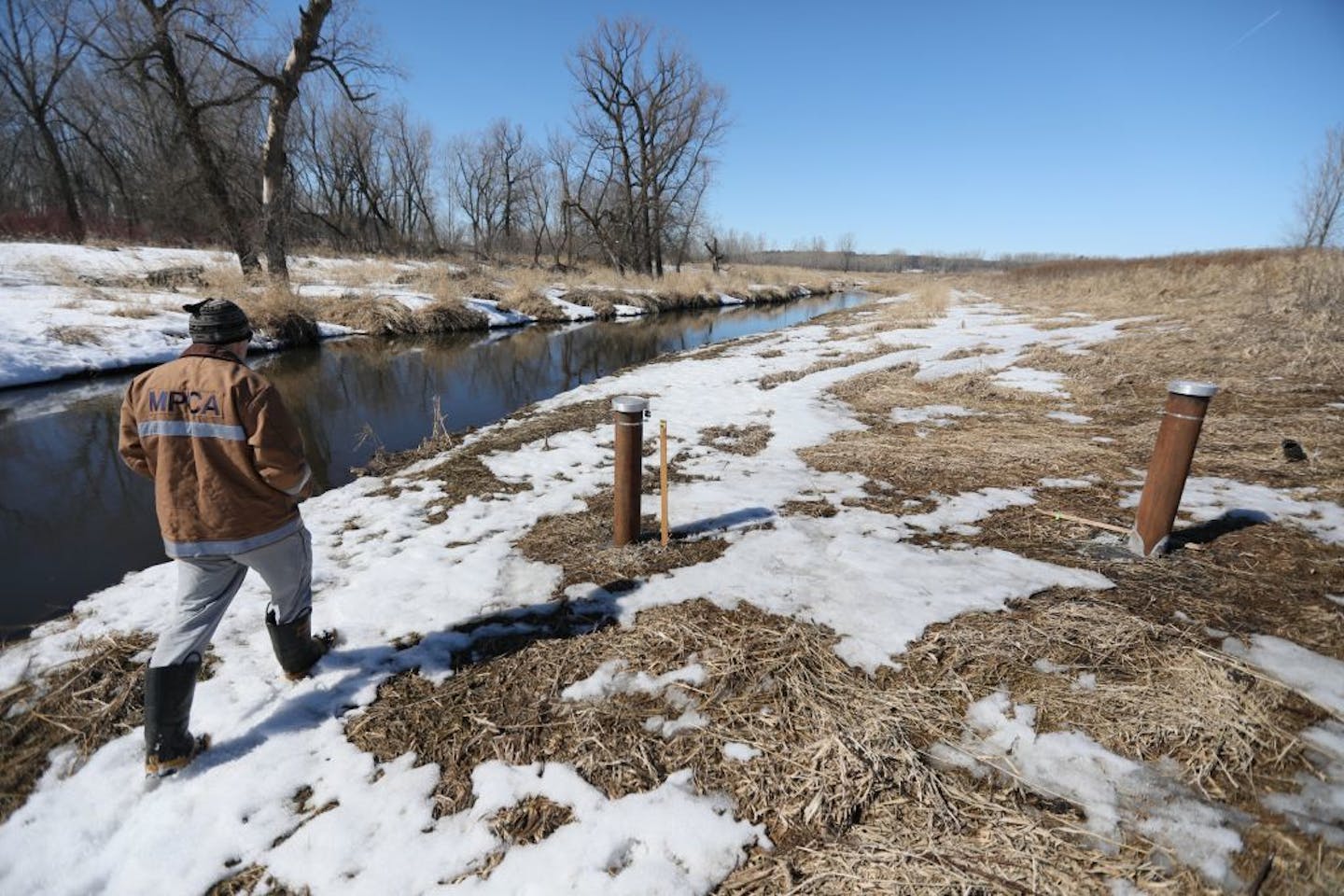 MPCA's lead Superfund official Hans Neve walks along Battle Creek near two well head testing sites. The former dump site where barrels of toxic waste and leaking batteries once dotted the landscape around Pig's Eye Lake, is the largest dump left from the days before regulated landfills. Cleaning up the Superfund site has been a slow process, but regulators are now leaning on the Met Council to address soils believed to be contaminated with metals from incinerated wastewater sludge. The Met Counc