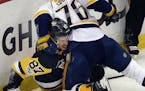 Nashville Predators' P.K. Subban (76) tangles with Pittsburgh Penguins' Sidney Crosby (87) during the first period in Game 5 of the NHL hockey Stanley