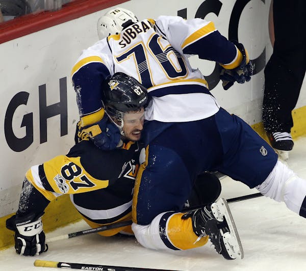 Nashville Predators' P.K. Subban (76) tangles with Pittsburgh Penguins' Sidney Crosby (87) during the first period in Game 5 of the NHL hockey Stanley