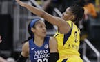 Minnesota Lynx's Maya Moore (23) makes a pass against Indiana Fever's Kelsey Mitchell during the second half of a WNBA basketball game, Wednesday, Jul