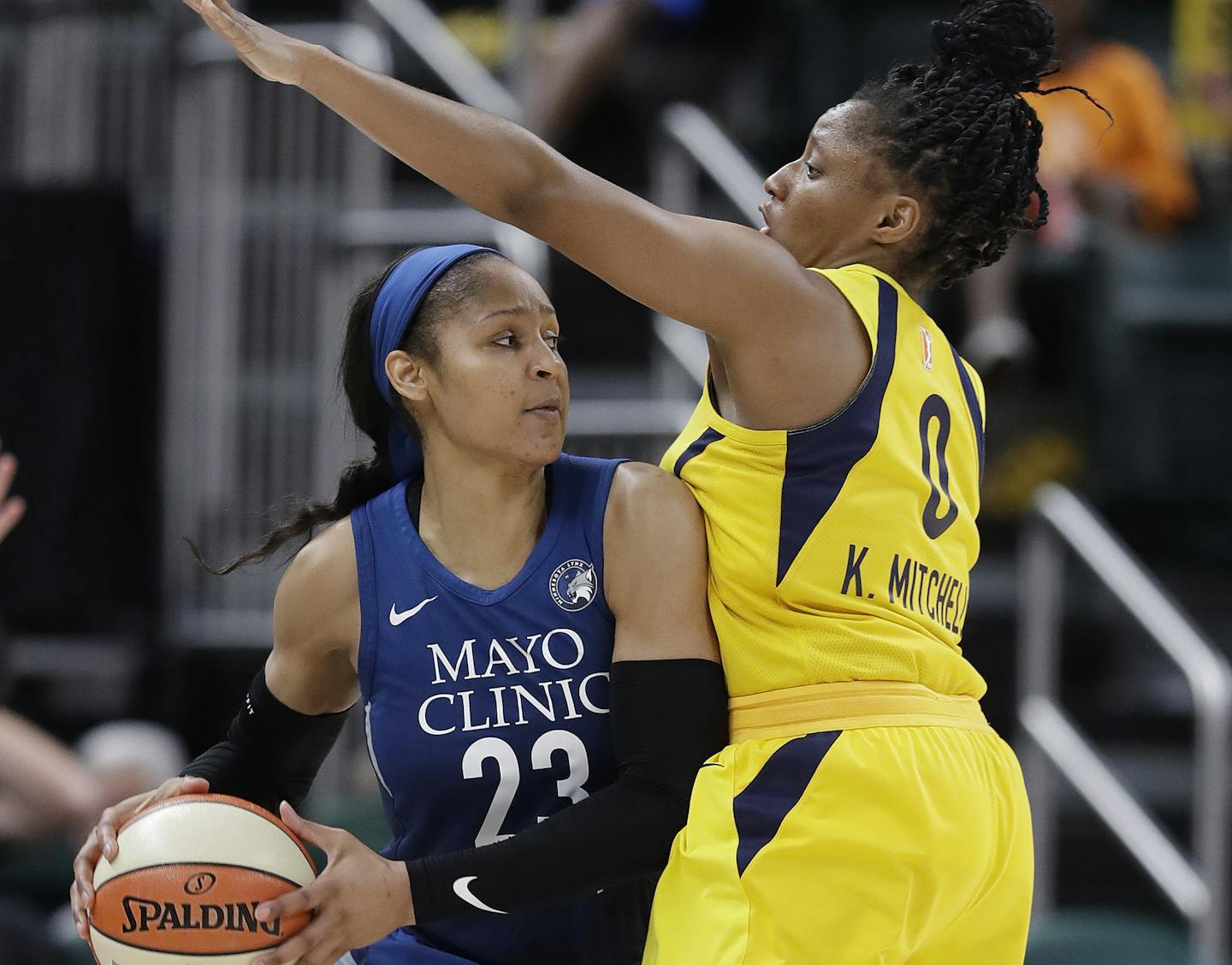 Minnesota Lynx's Maya Moore (23) makes a pass against Indiana Fever's Kelsey Mitchell during the second half of a WNBA basketball game, Wednesday, July 11, 2018, in Indianapolis. Minnesota won 87-65. (AP Photo/Darron Cummings)