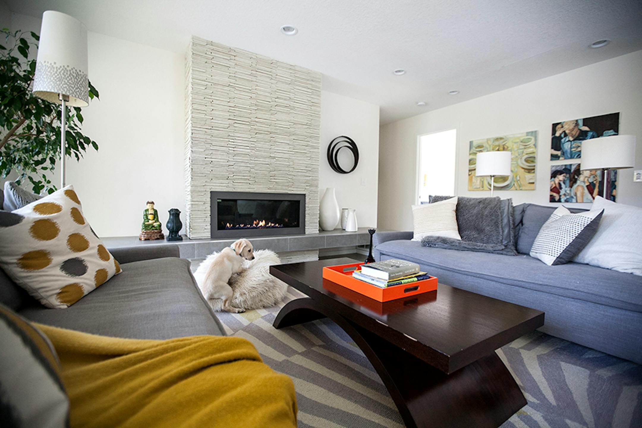 In the living room, a sleek linear gas fireplace fits the home's modern aesthetic.