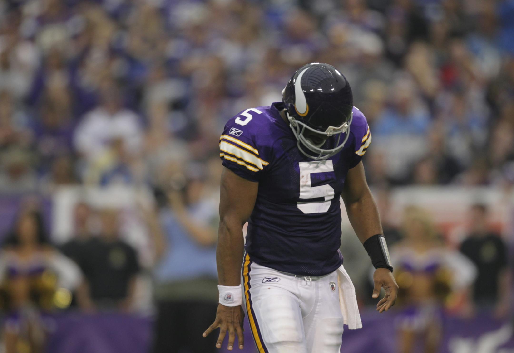 Vikings quarterback Donovan McNabb headed, head down, to the bench after failing to complete a third-down, third-quarter pass to Michael Jenkins.