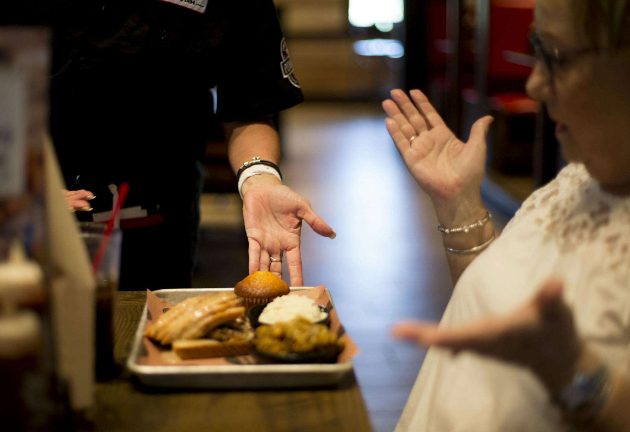 Merice Unruh reacts with awe when her food arrives to the table.
