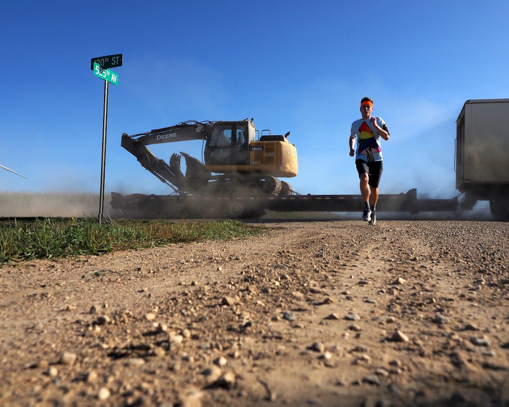 Shown near Cosmos in west-central Minnesota, Meyer has been running since leaving the South Dakota border Sept. 4 and documenting his trip online.