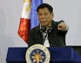 FILE - In this June 30, 2016, file photo, Philippine President Rodrigo Duterte gestures as he delivers his speech before a solidarity dinner with the 